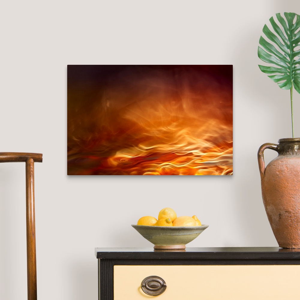 A traditional room featuring Abstract digital art with orange, yellow, and red hues resembling water on fire.
