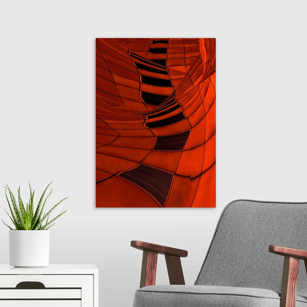 A modern room featuring Abstract image of a moving, twisted landscape made of red tiles and grates.