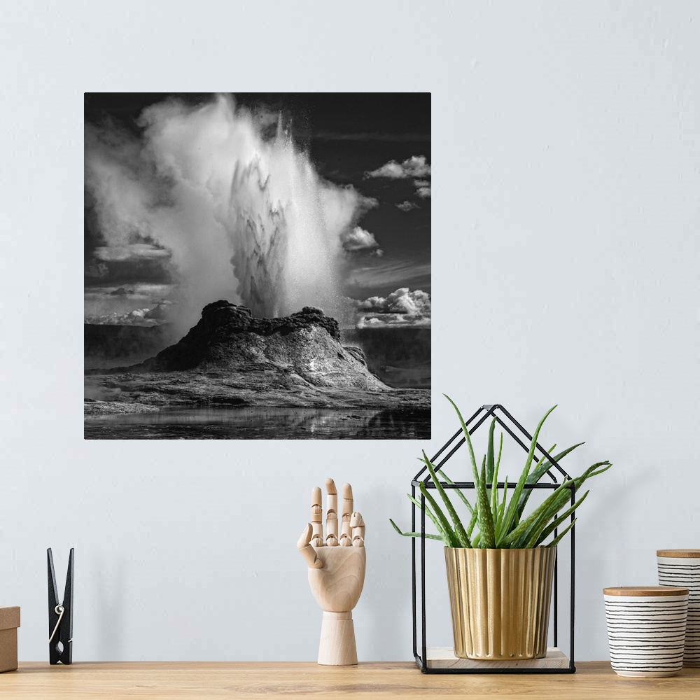 A bohemian room featuring An erupting geyser spewing water and steam into the air, Yellowstone, Wyoming.
