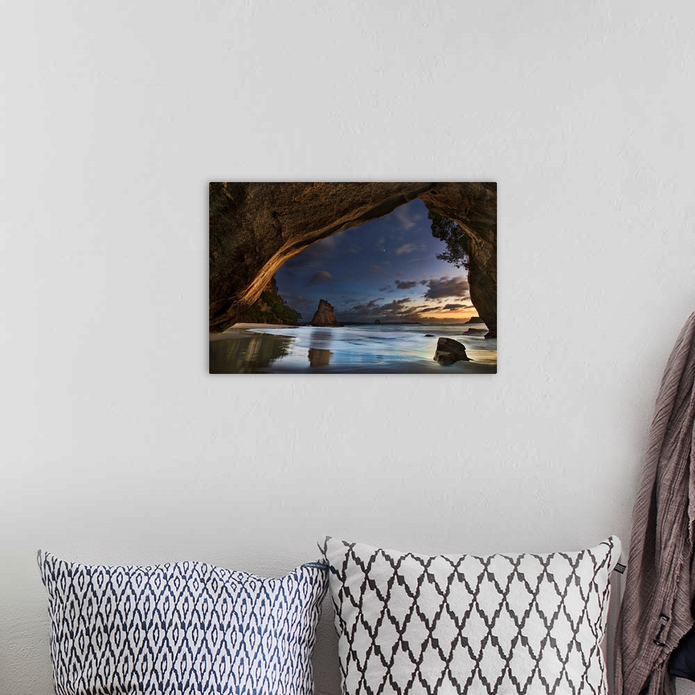 A bohemian room featuring Seascape from a beachside cave at twilight, Hahei Coast, New Zealand.