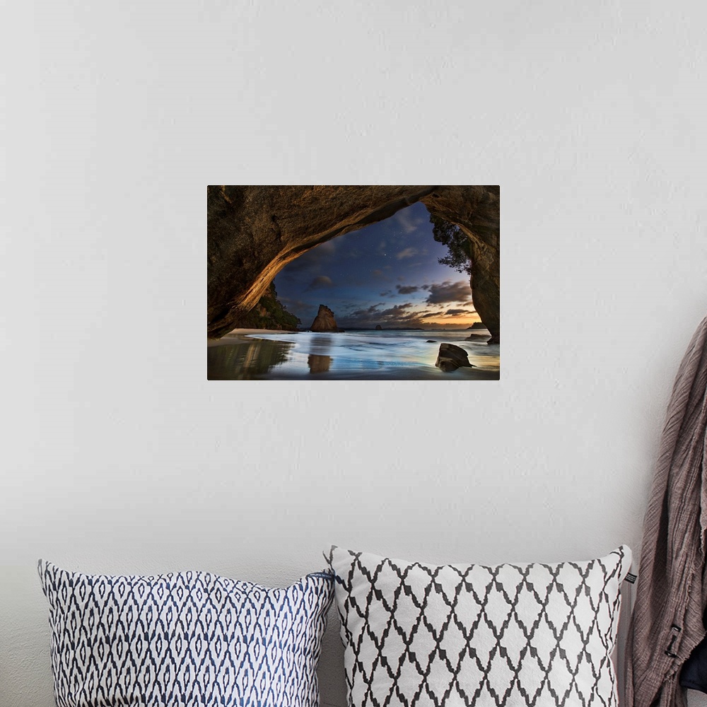 A bohemian room featuring Seascape from a beachside cave at twilight, Hahei Coast, New Zealand.