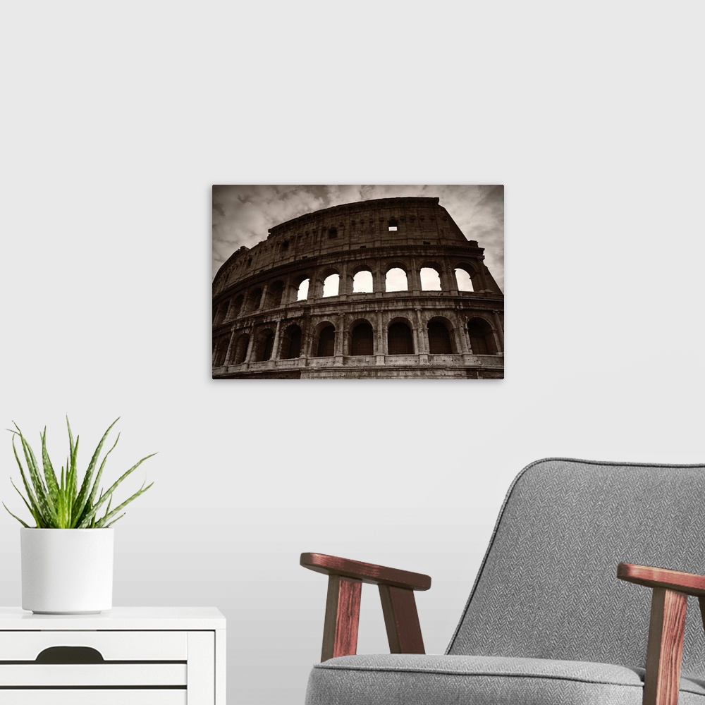 A modern room featuring Sepia photograph of the Colosseum in Rome on a cloudy day.