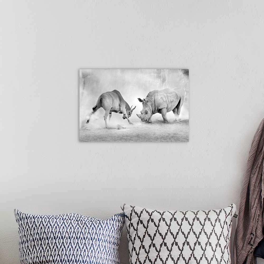 A bohemian room featuring Black and white image of a standoff between an antelope and a rhinoceros.