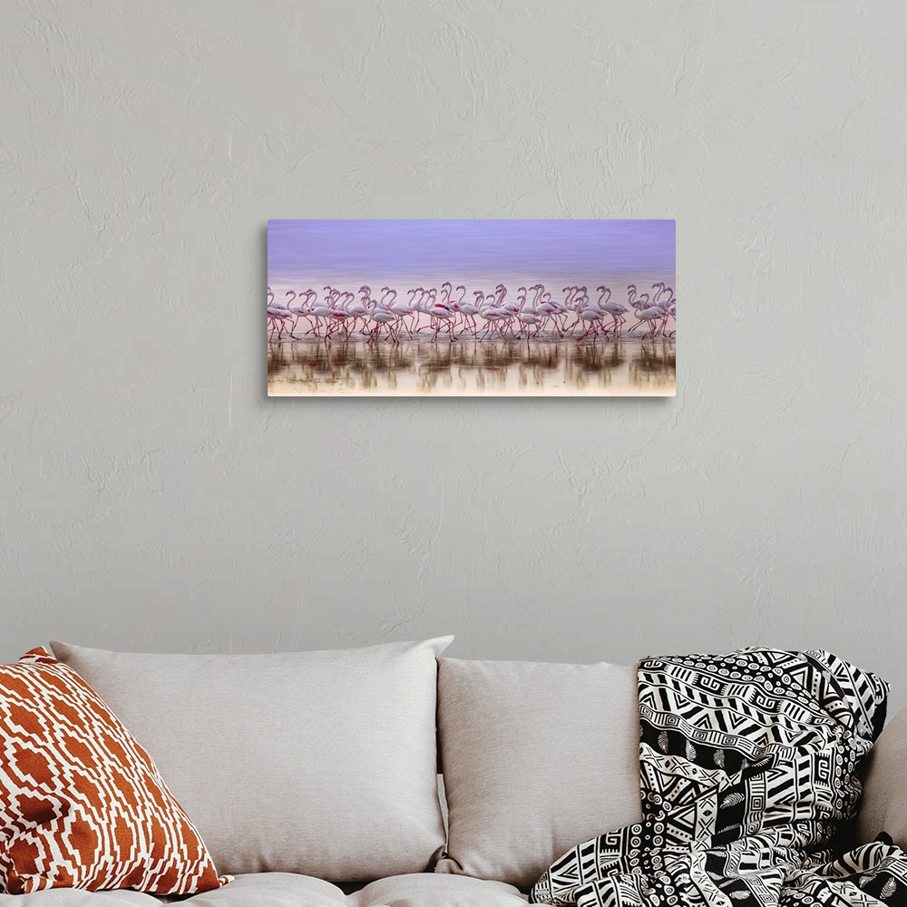 A bohemian room featuring Panoramic photograph of a flock of pink flamingos running down the seashore.