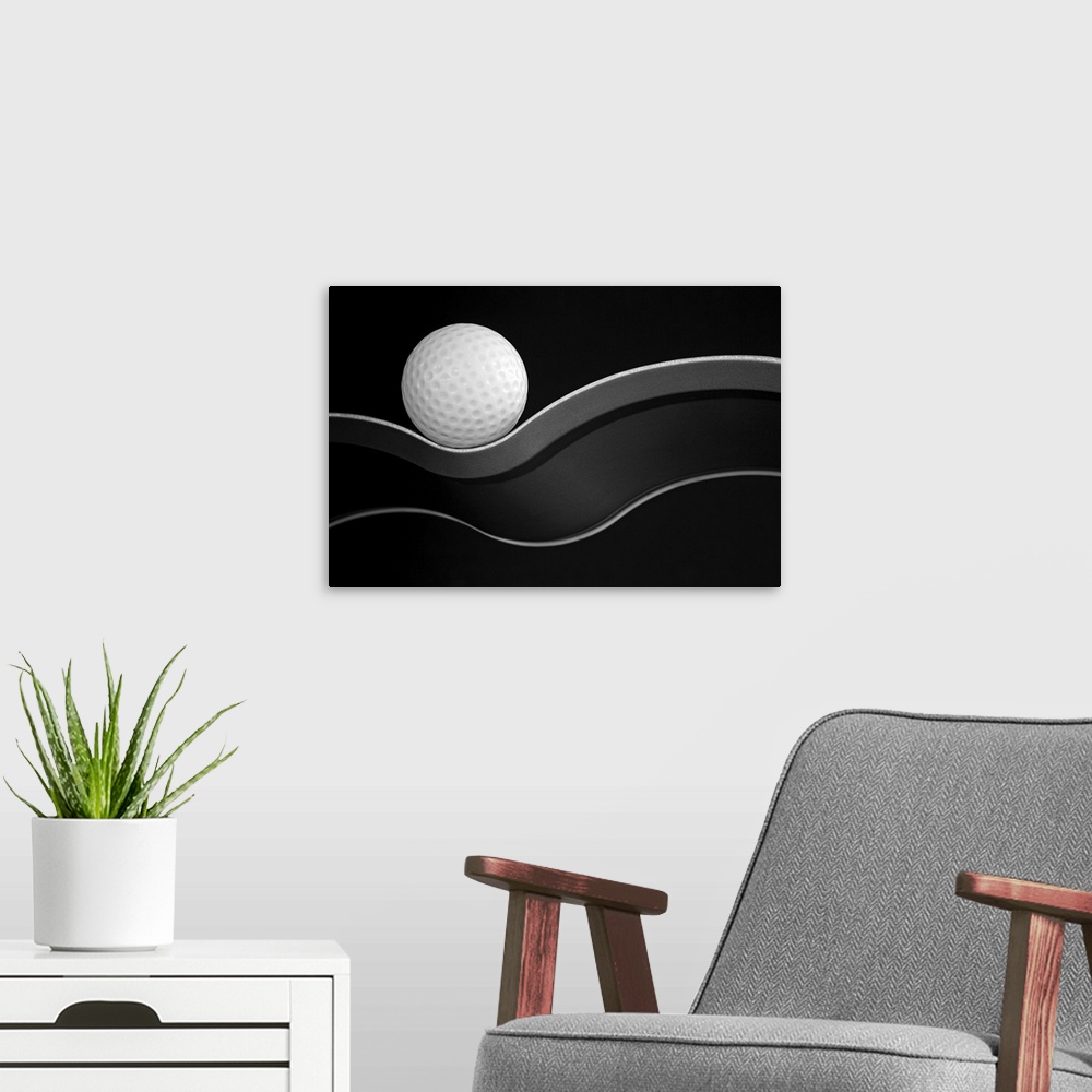 A modern room featuring A golf ball nestled on a curve.