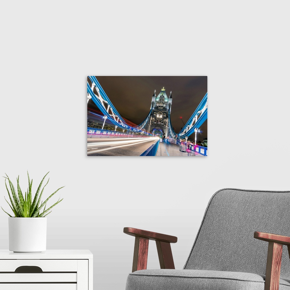 A modern room featuring London Tower Bridge in one cold and raing night.