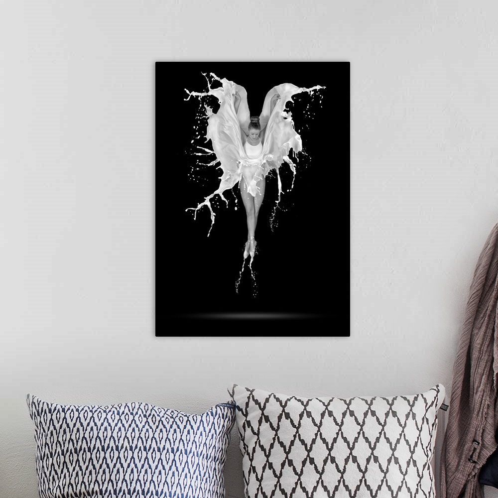 A bohemian room featuring A black and white photograph of a ballerina in the air with her skirt flowing around in the form ...