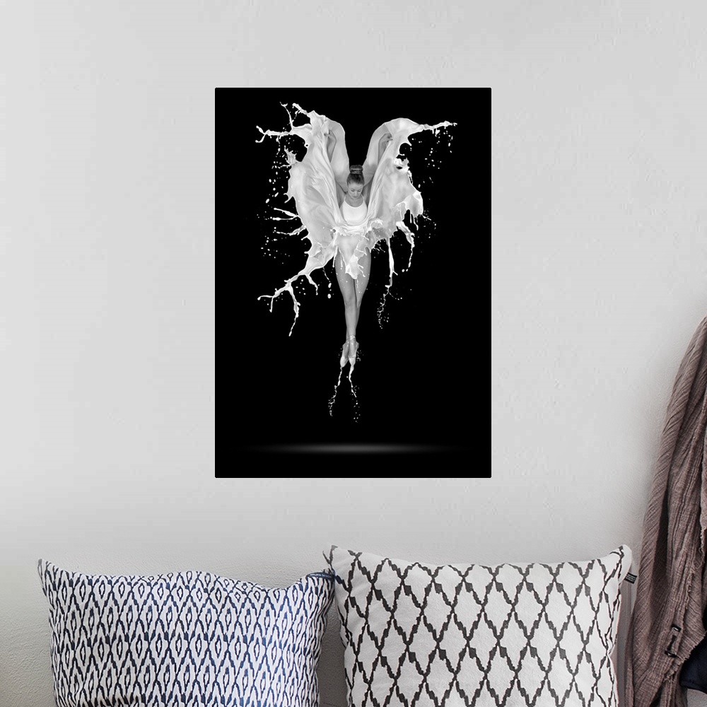 A bohemian room featuring A black and white photograph of a ballerina in the air with her skirt flowing around in the form ...