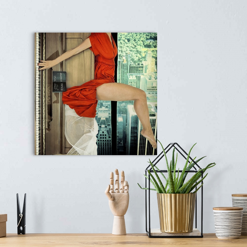 A bohemian room featuring A conceptual photograph of a woman in red dress laying on the top of a piano with her fingers gen...