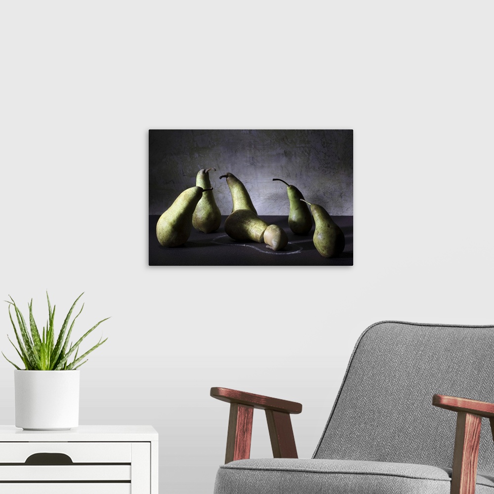 A modern room featuring Conceptual image of a group of pears appearing concerned over a sliced pear on the ground.