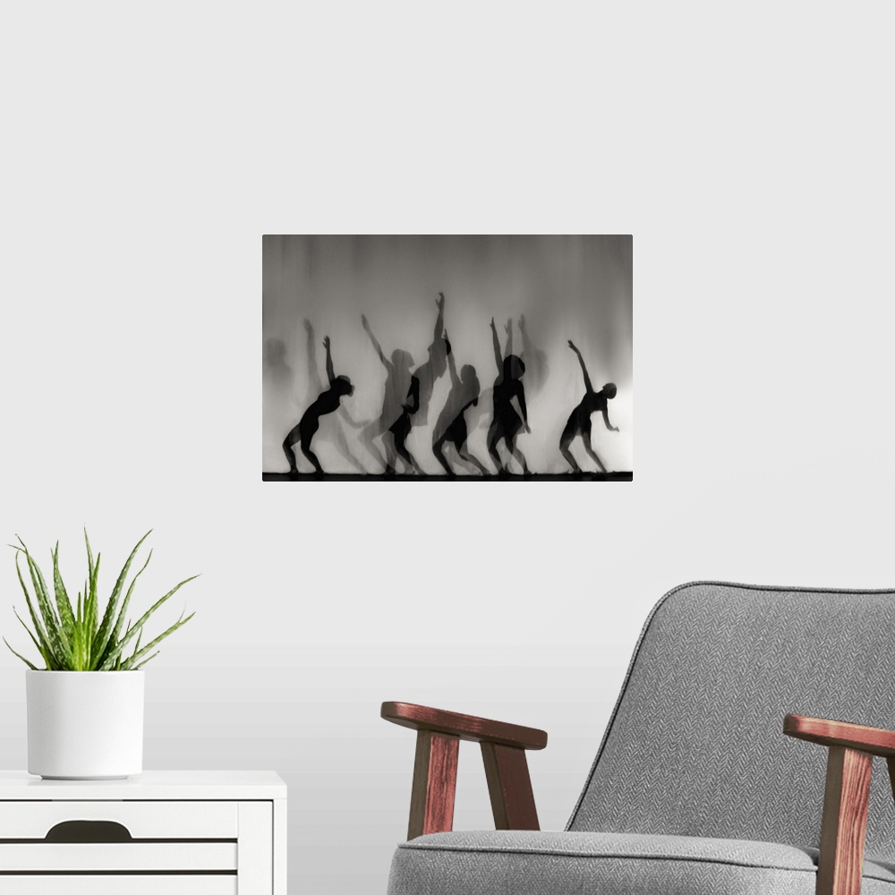 A modern room featuring Silhouettes of female forms in dancing positions.