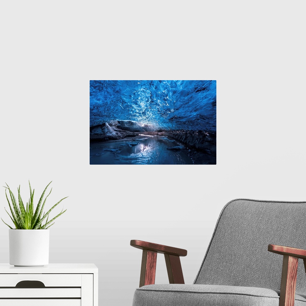 A modern room featuring A view of the ceiling of an ice cave from inside it, Iceland.