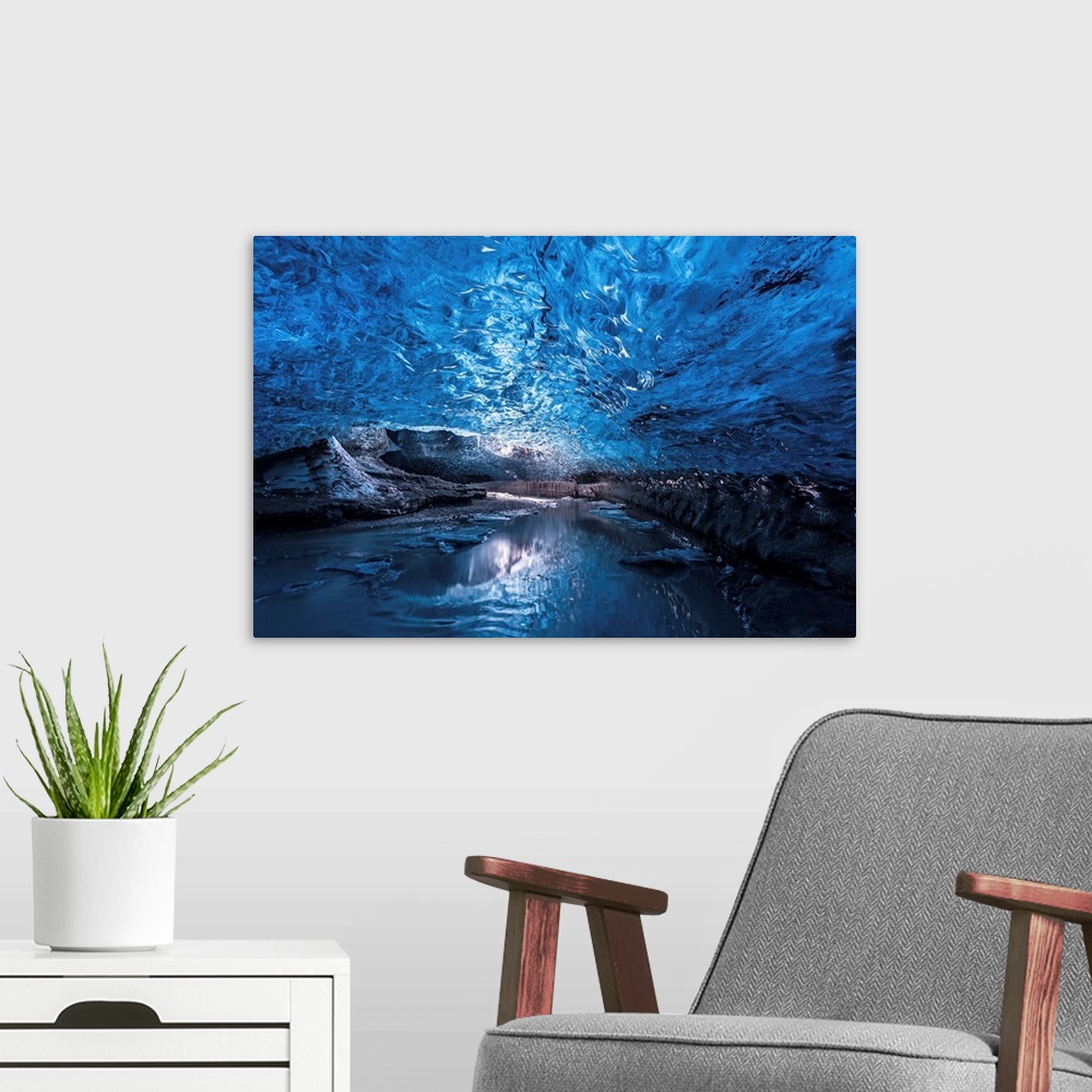 A modern room featuring A view of the ceiling of an ice cave from inside it, Iceland.