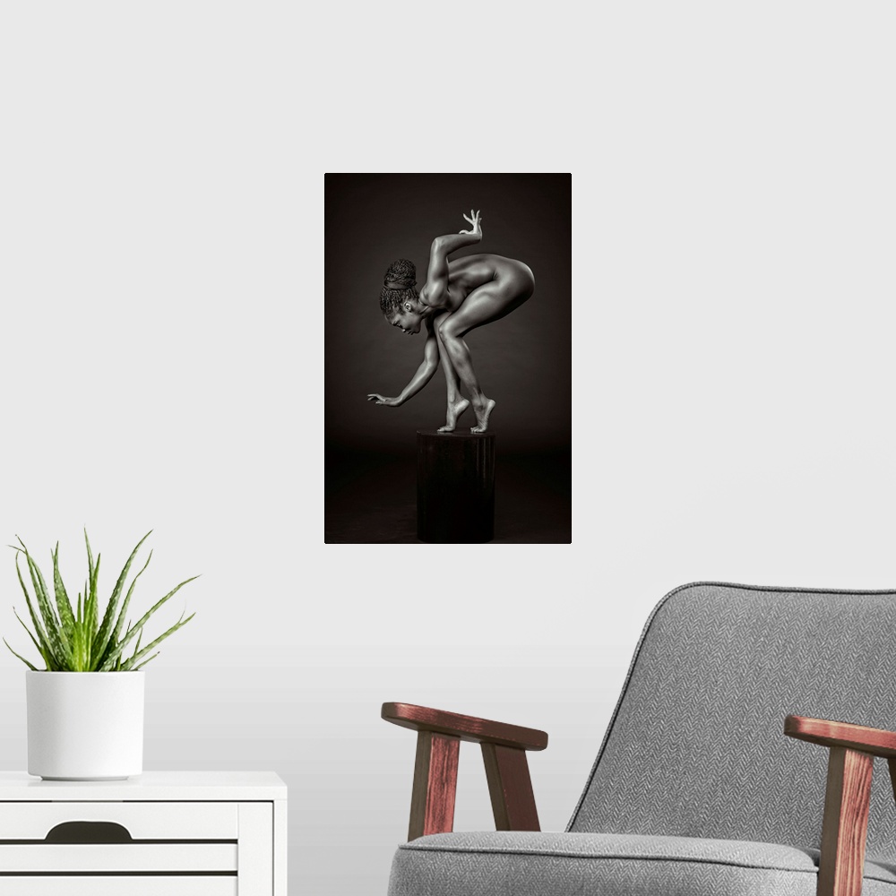 A modern room featuring Black and white fine art photograph of an African American woman balancing and posing on a pedest...