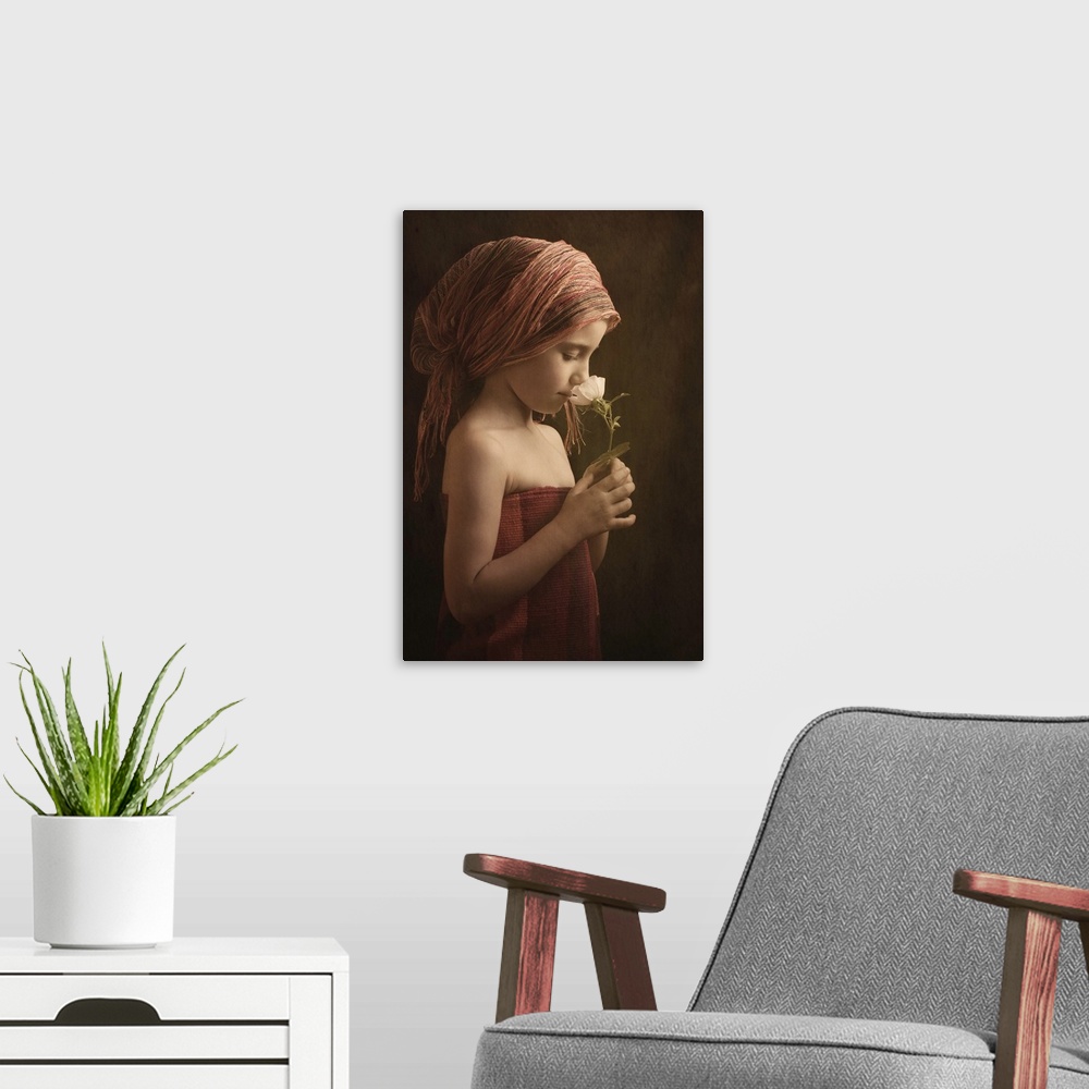 A modern room featuring Portrait of a girl wearing robes smelling a flower.