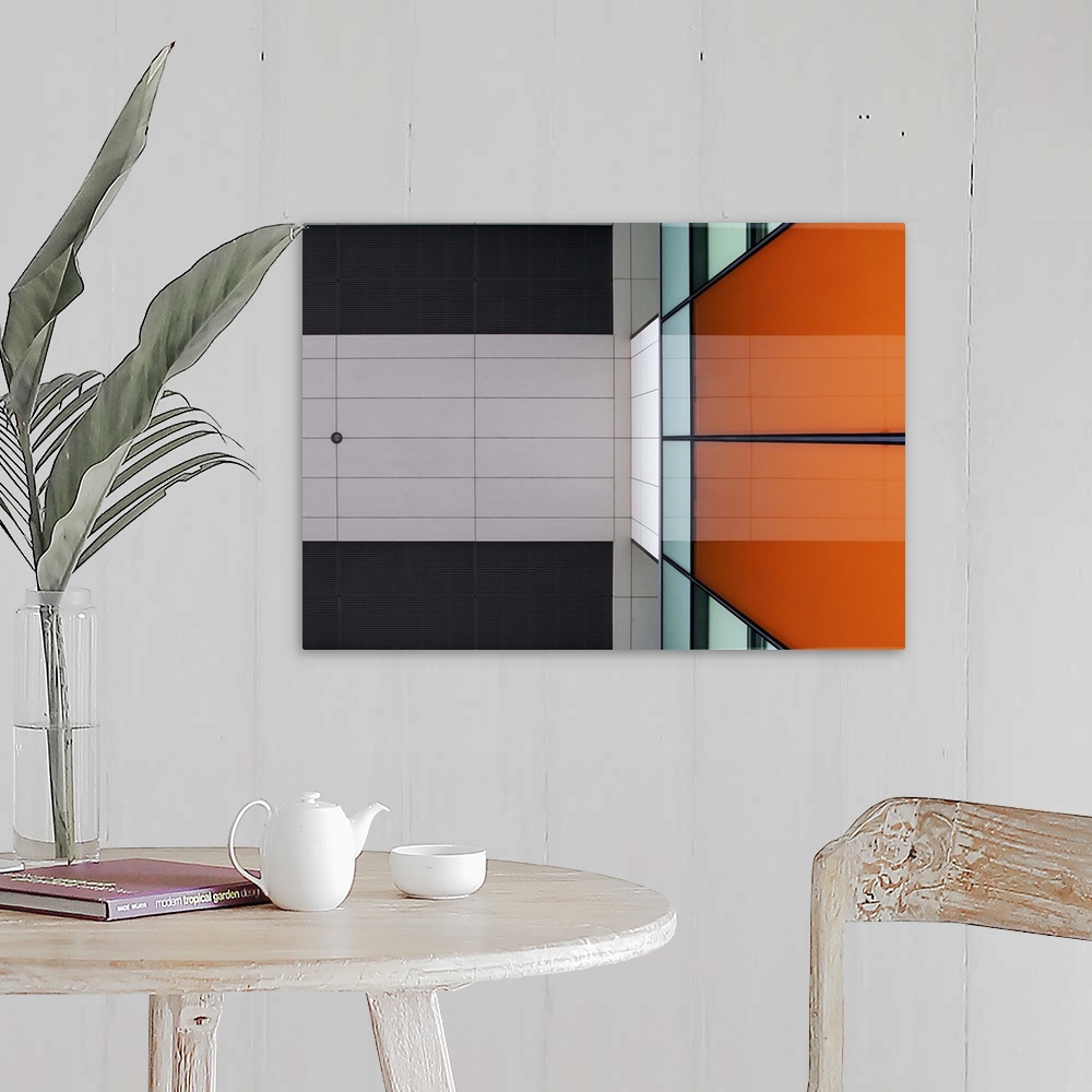 A farmhouse room featuring Orange glass and ceiling panels create an abstract image in Amsterdam.