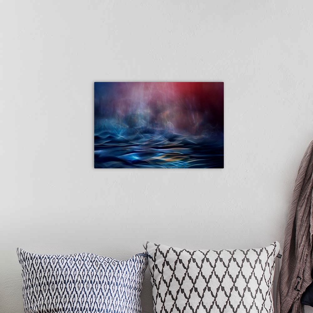 A bohemian room featuring Abstract image made of blurred light and color, resembling an ocean in the evening.