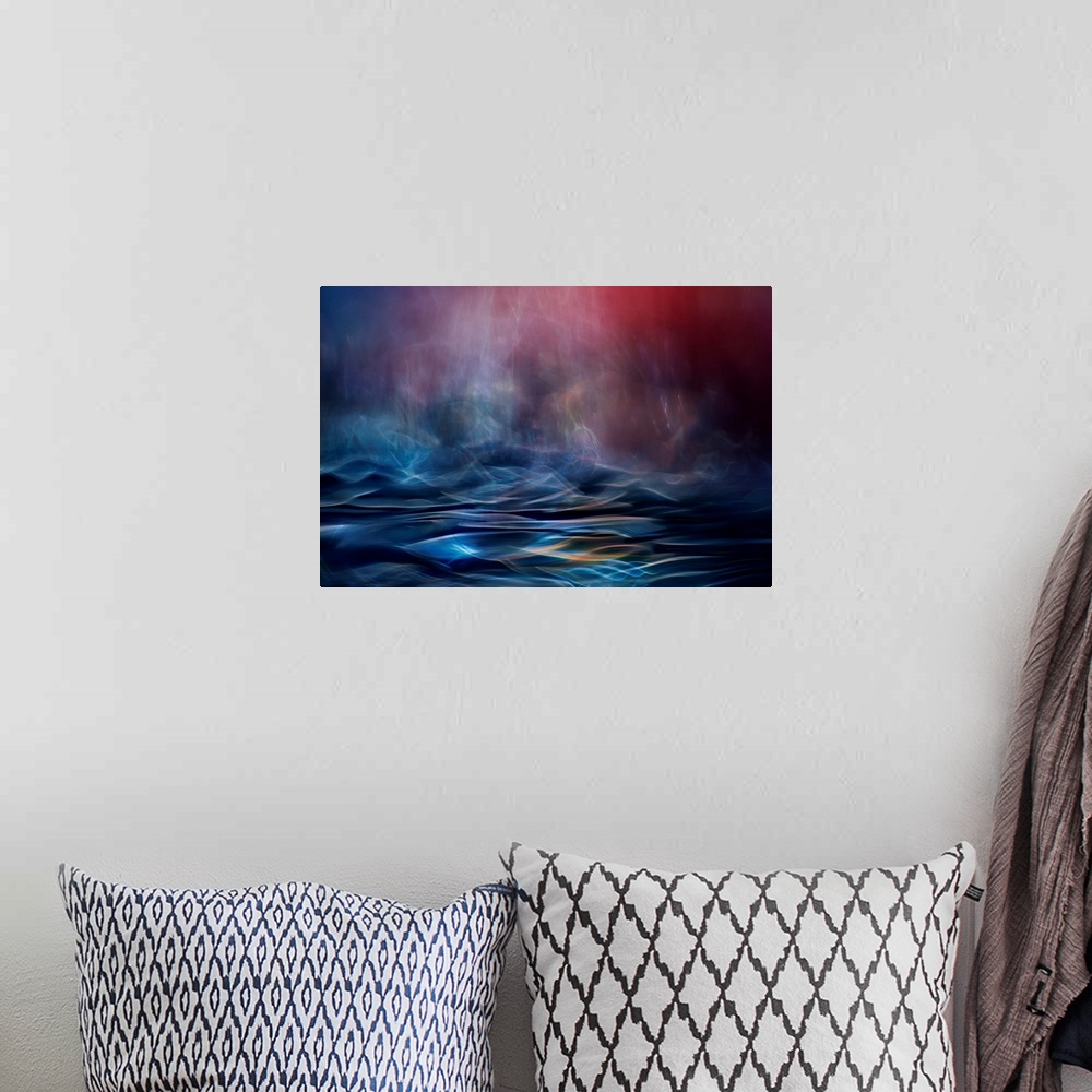 A bohemian room featuring Abstract image made of blurred light and color, resembling an ocean in the evening.