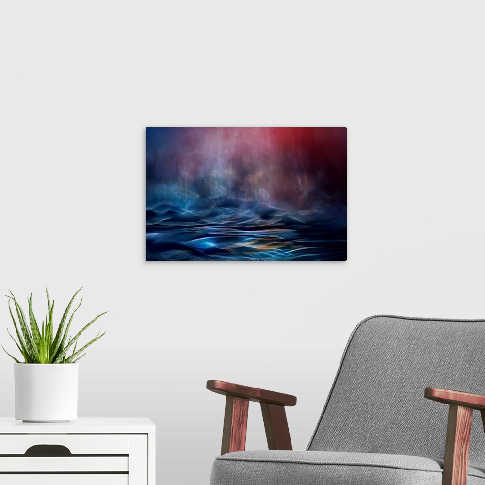 A modern room featuring Abstract image made of blurred light and color, resembling an ocean in the evening.