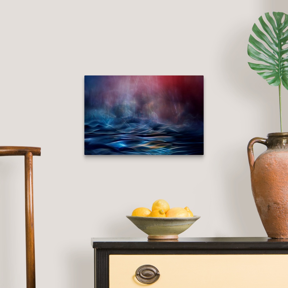 A traditional room featuring Abstract image made of blurred light and color, resembling an ocean in the evening.