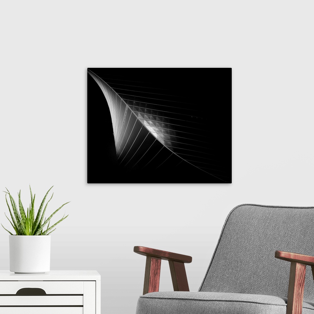A modern room featuring Black and white architectural abstract photograph of the Kuwait Trading Center.