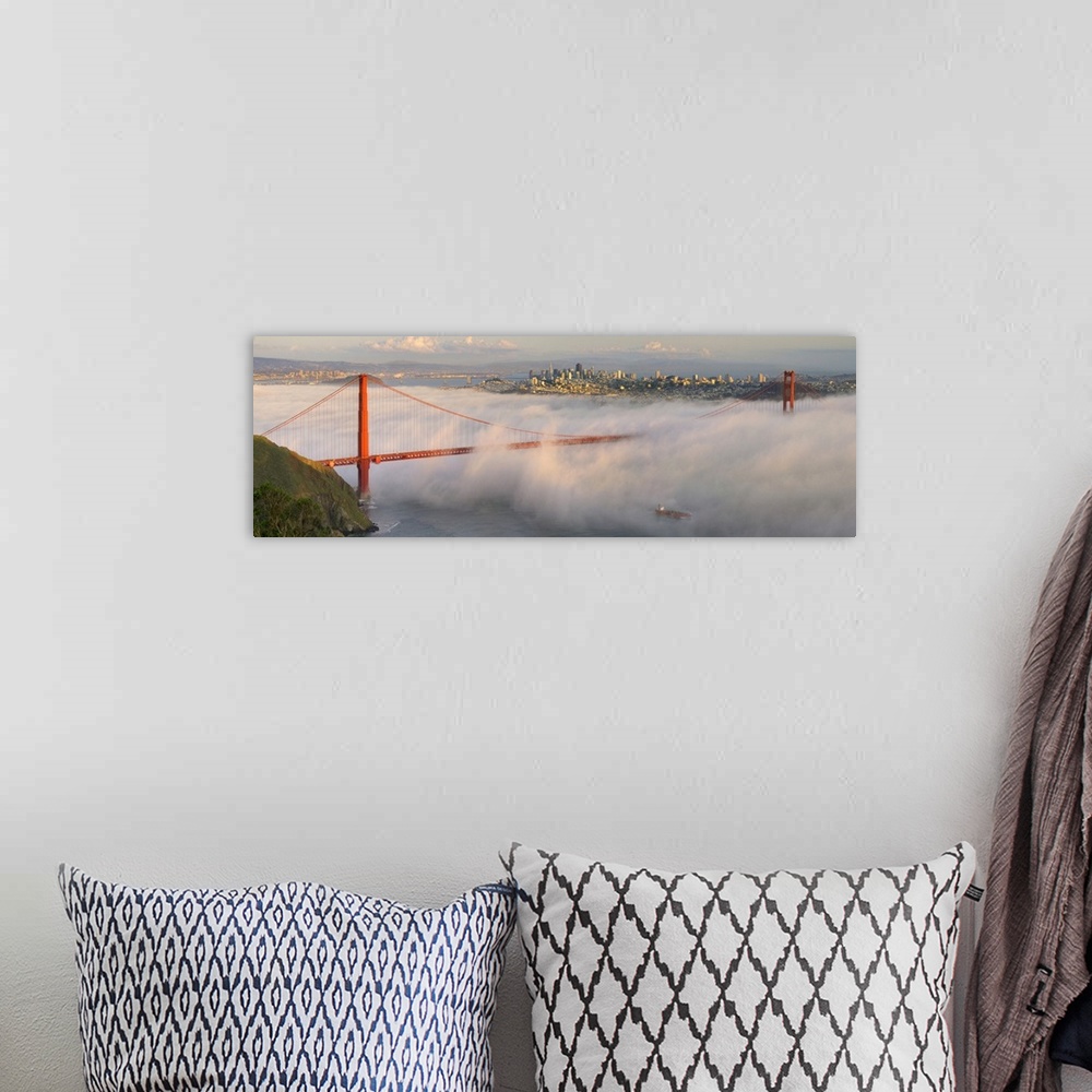 A bohemian room featuring Panoramic photograph of the foggy Golden Gate Bridge in San Fransisco with the skyline in the bac...