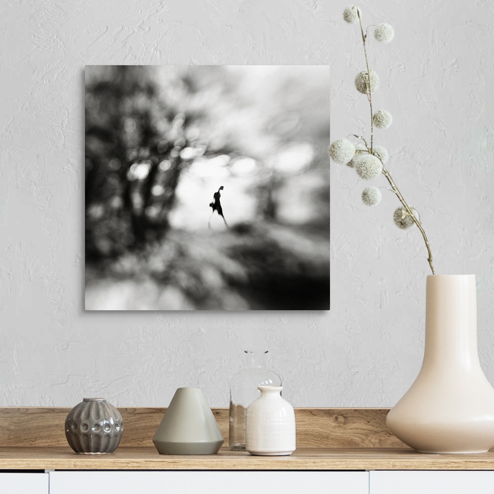 A farmhouse room featuring Conceptual image of a figure walking in a blurred landscape.