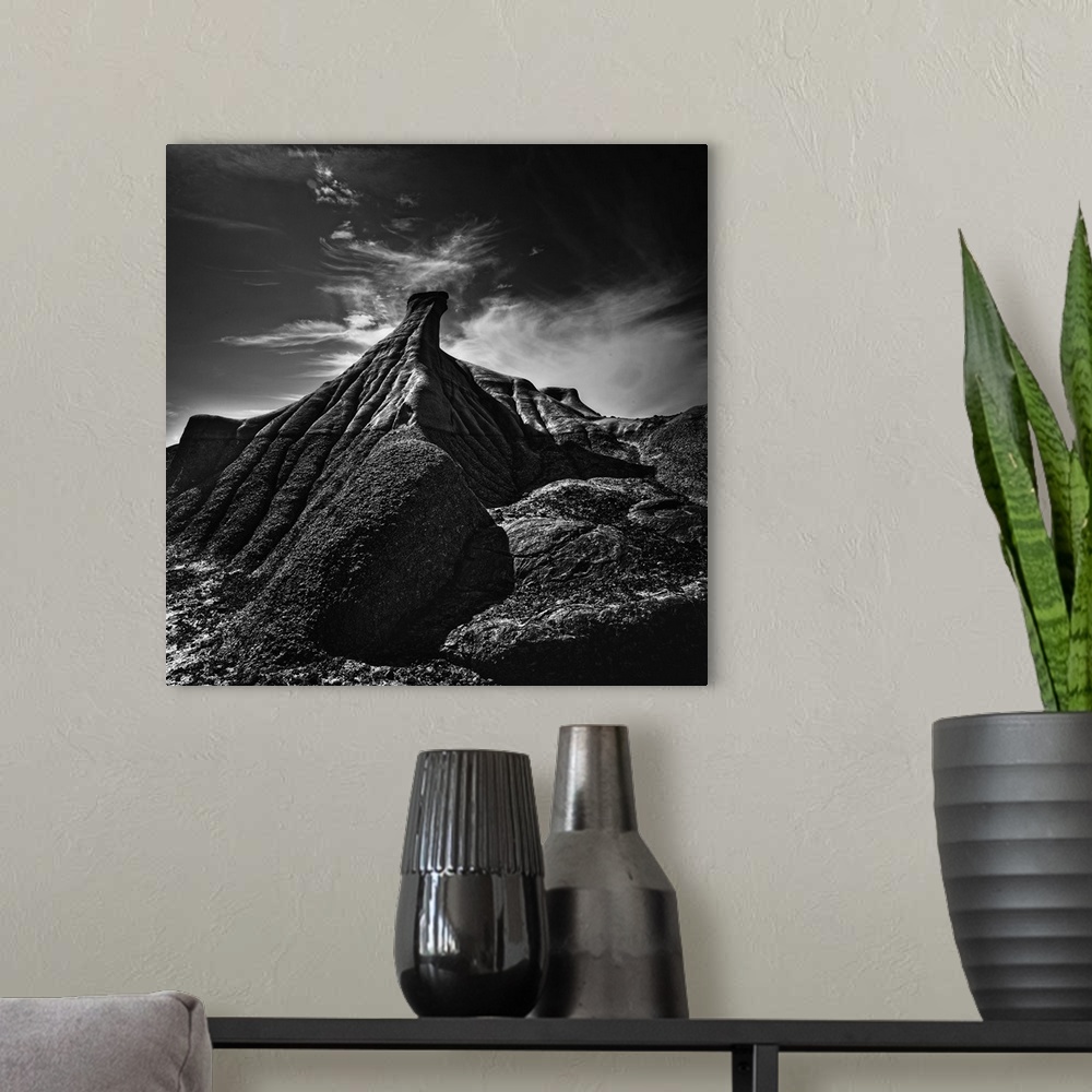 A modern room featuring High contrast photograph of a rock formation in an arid desert landscape.
