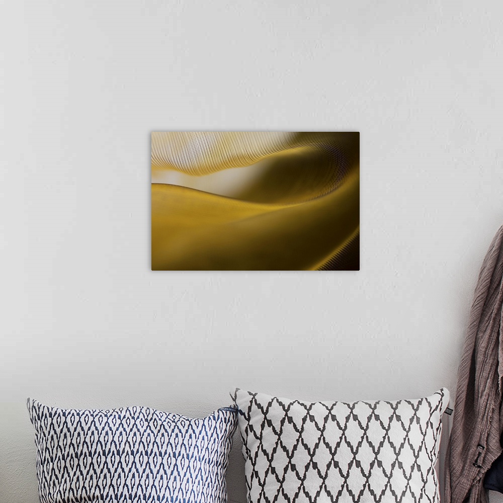 A bohemian room featuring Abstract image of the folds and fibers of golden fabric.