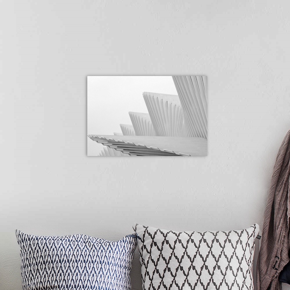 A bohemian room featuring Interesting abstract architecture against a foggy white background.