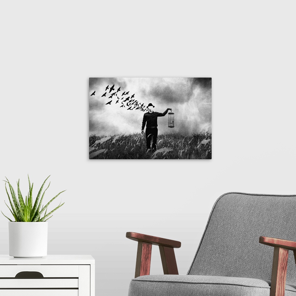 A modern room featuring Conceptual photograph of a man standing in a field holding a bird cage with his face dematerializ...