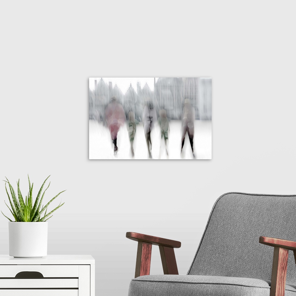 A modern room featuring Abstract image of five figures walking in a city street, with blurred motion and altered colors.