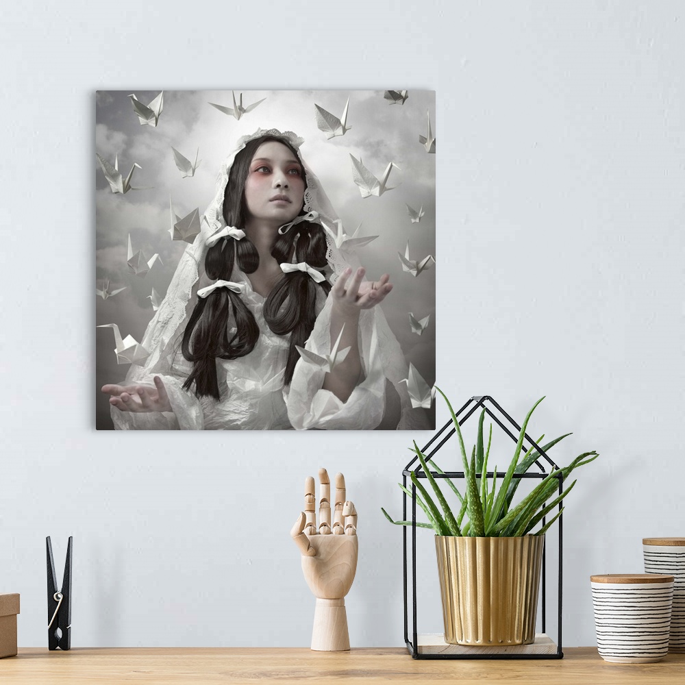 A bohemian room featuring Conceptual image of a beautiful woman in a white robe with paper cranes floating around her.