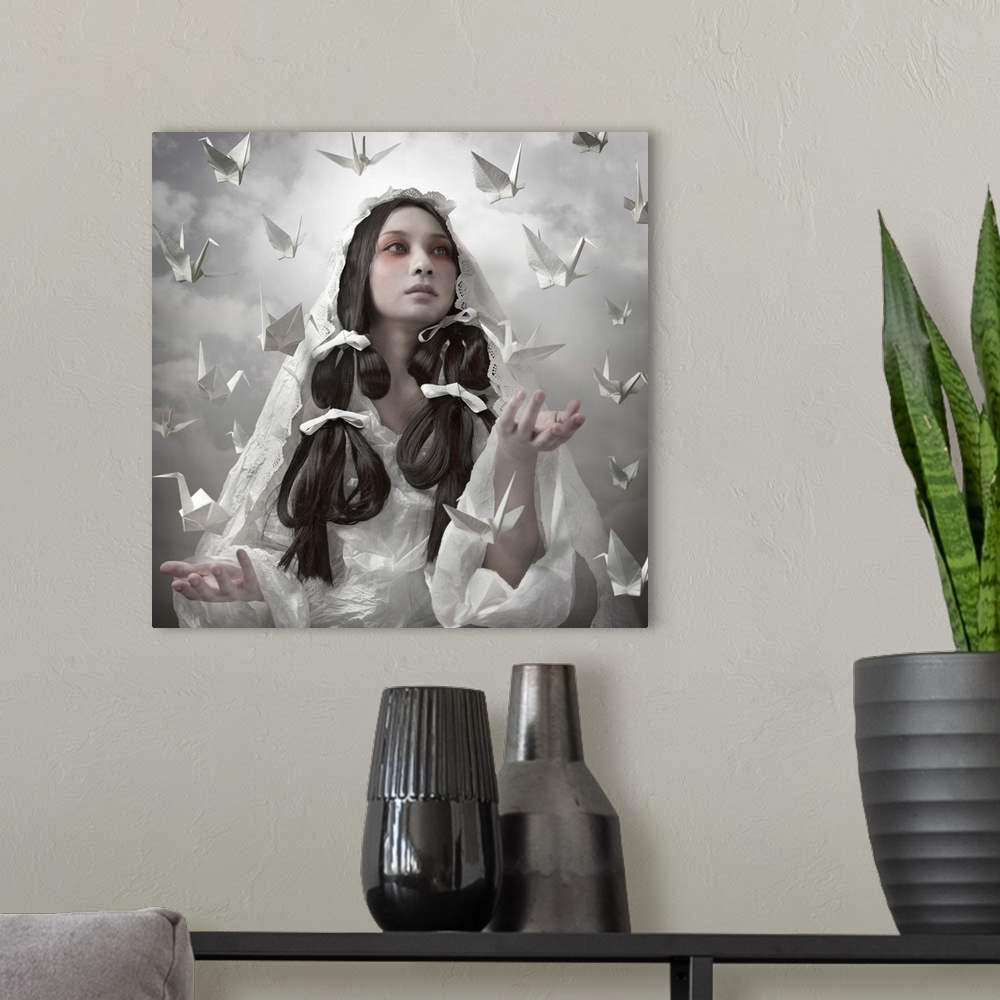 A modern room featuring Conceptual image of a beautiful woman in a white robe with paper cranes floating around her.