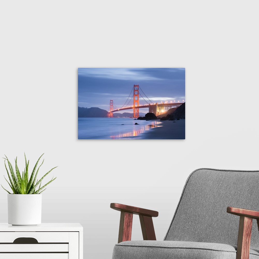 A modern room featuring A soft and dreamy photograph of the golden gate bridge in San Francisco lit up in the early evening