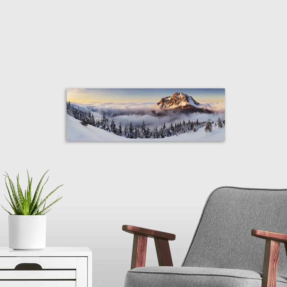 A modern room featuring Panorama of Rozsutec in the clouds at sunset, Mala Fatra, Slovakia.