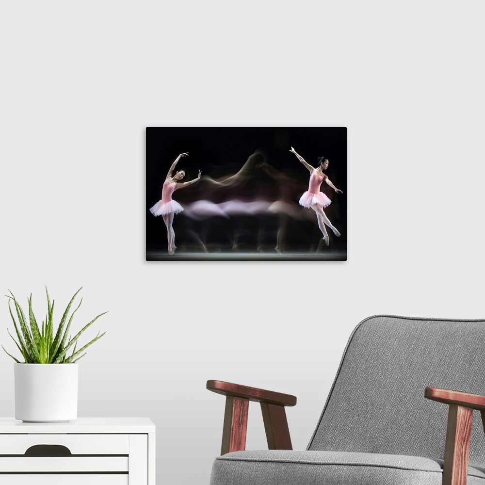 A modern room featuring Time-lapse image of a ballerina in a pink dress dancing across a stage.