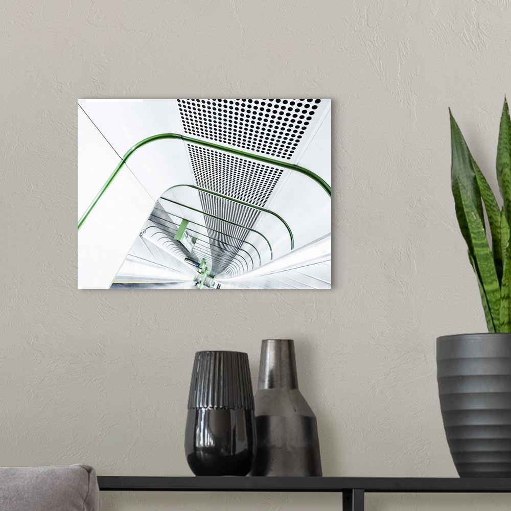 A modern room featuring Abstract view of a stark white tunnel in a train station lined with bright green lines.