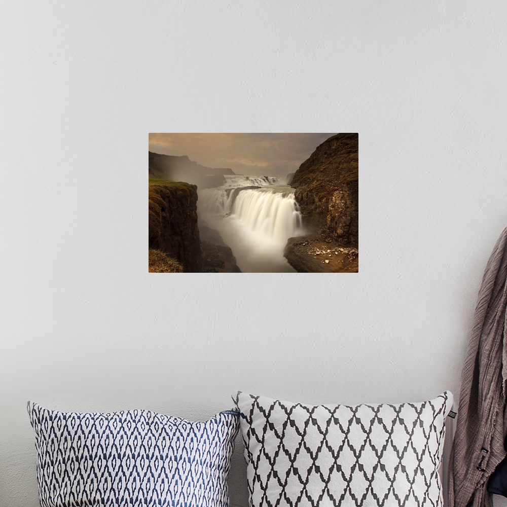 A bohemian room featuring A view of the beautiful Gullfoss Waterfall in the mountains of Iceland.