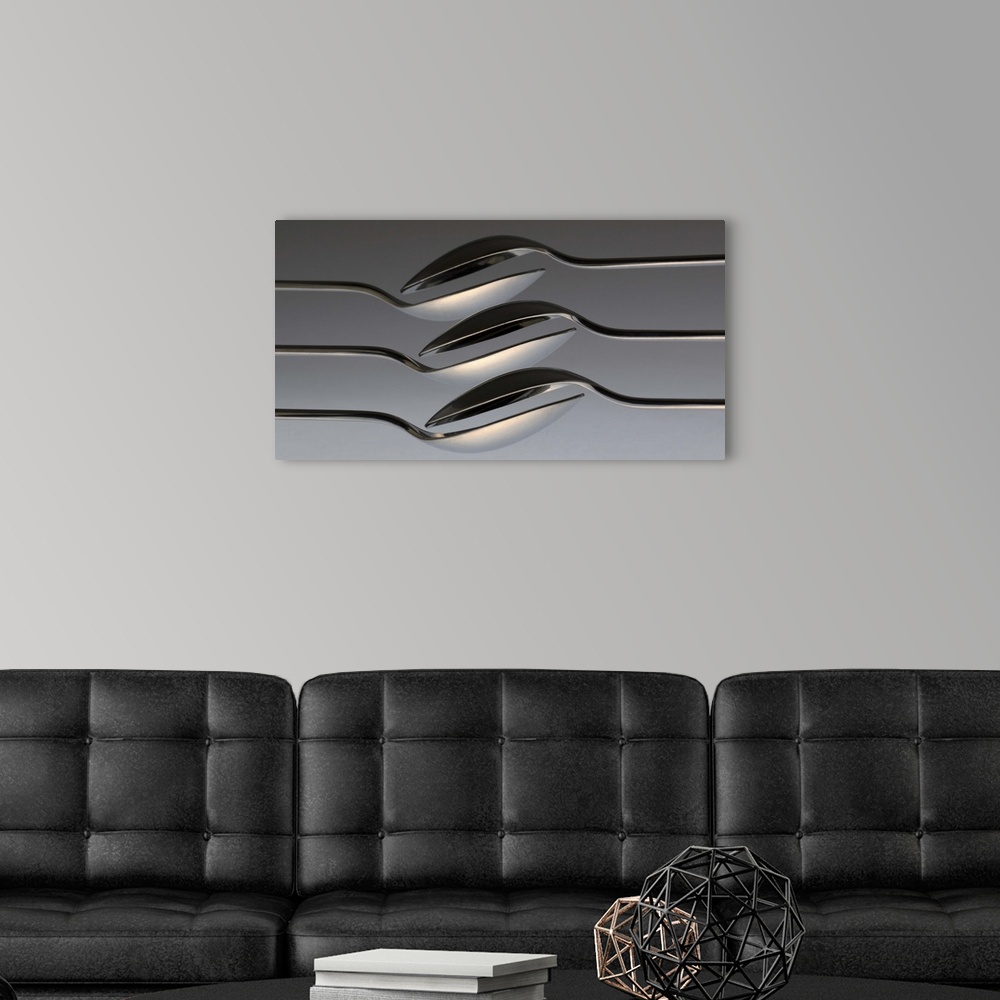 A modern room featuring Six spoons arranged to form a wave-like pattern.