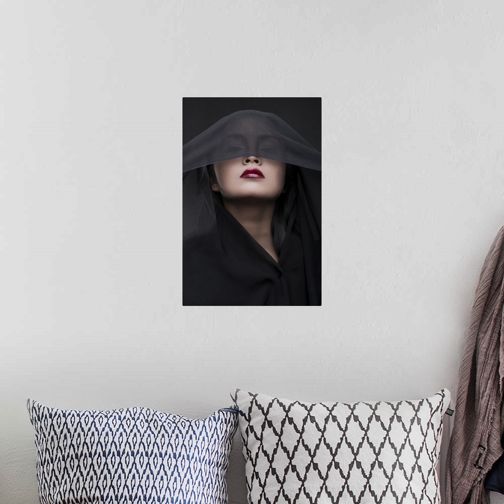 A bohemian room featuring Portrait of a woman with red lipstick and a black veil over her eyes.