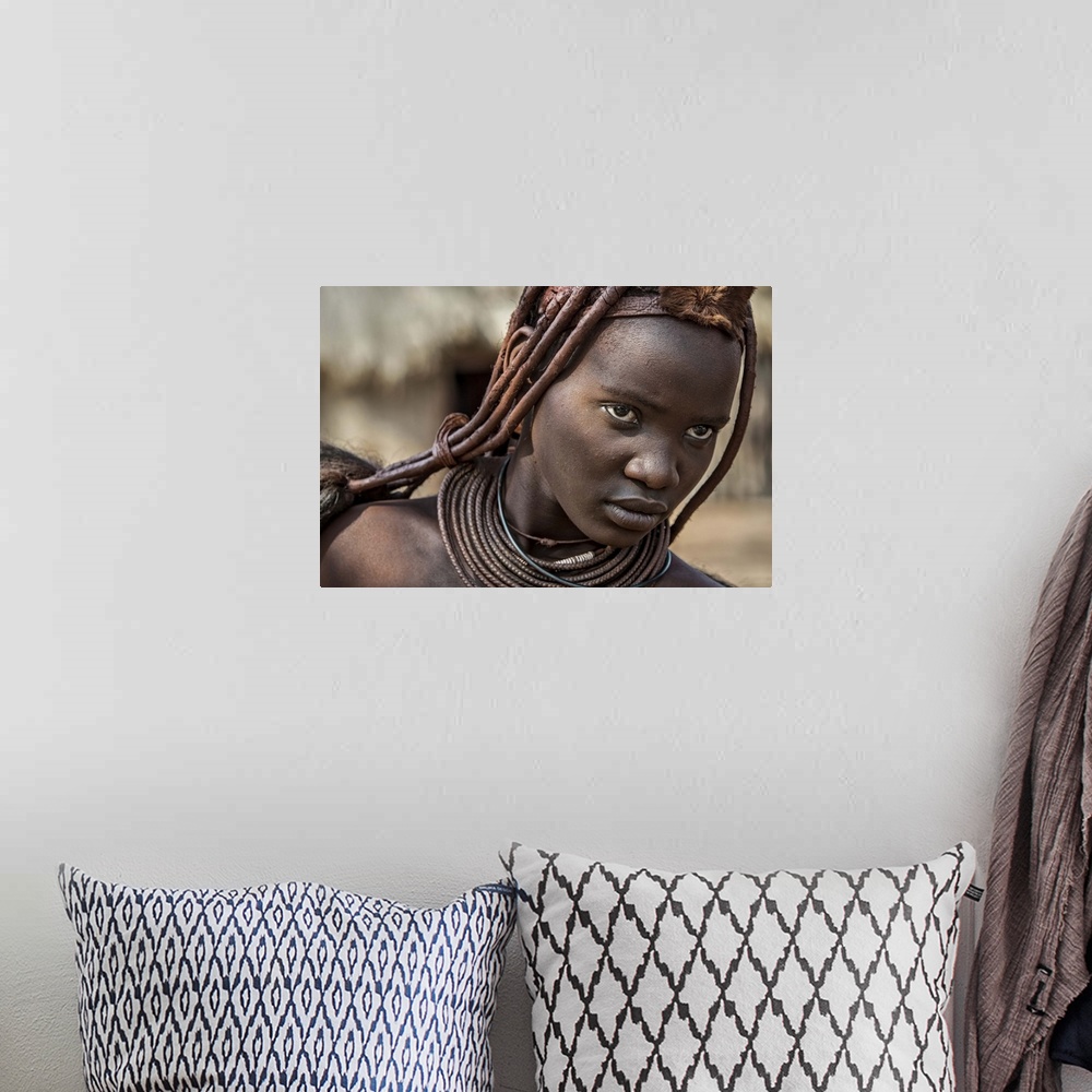 A bohemian room featuring Tribeswoman with a fierce look on her face.