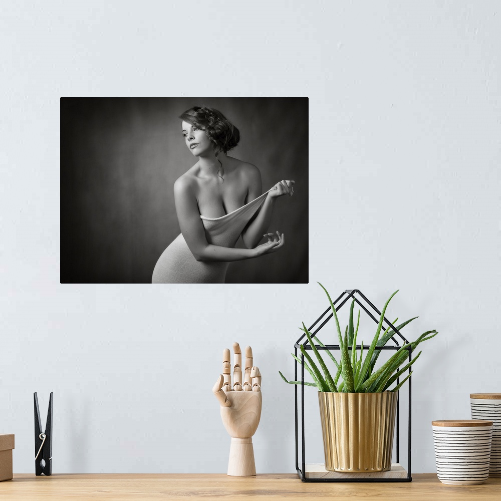 A bohemian room featuring Elegant black and white portrait of a woman undressing.