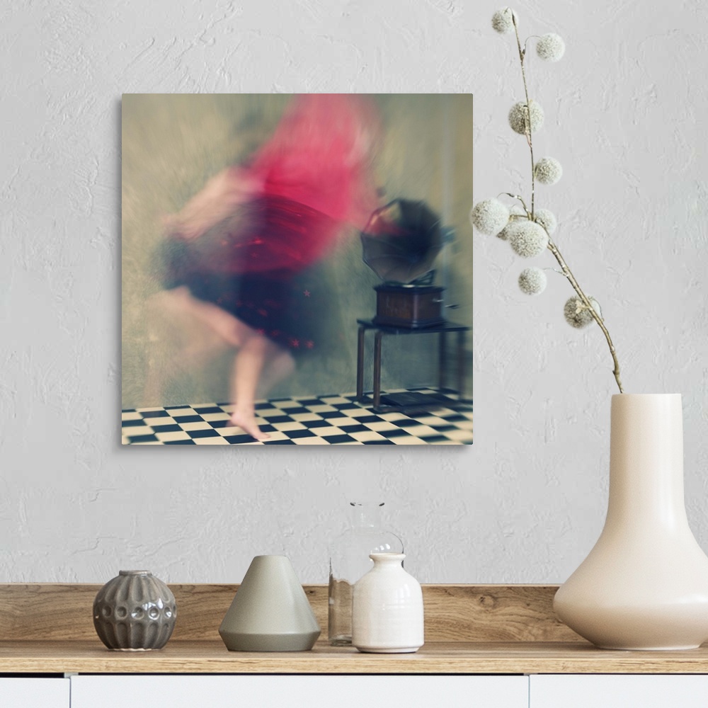 A farmhouse room featuring Blurred motion image of a woman in red dancing to music from a phonograph.