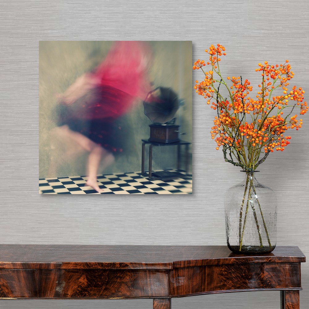 A traditional room featuring Blurred motion image of a woman in red dancing to music from a phonograph.