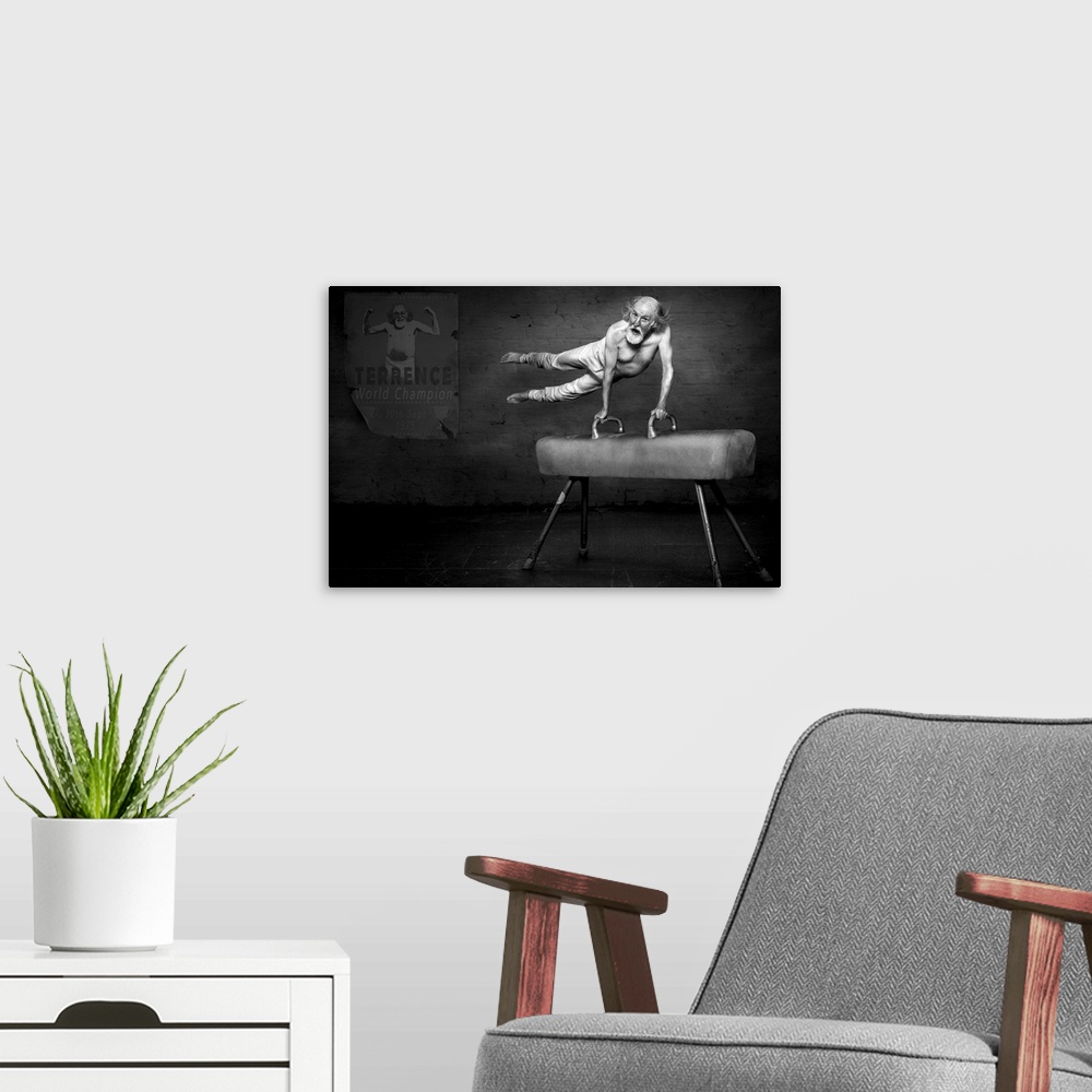 A modern room featuring Black and white portrait of an elderly man on a pommel horse, with a poster showing his accomplis...