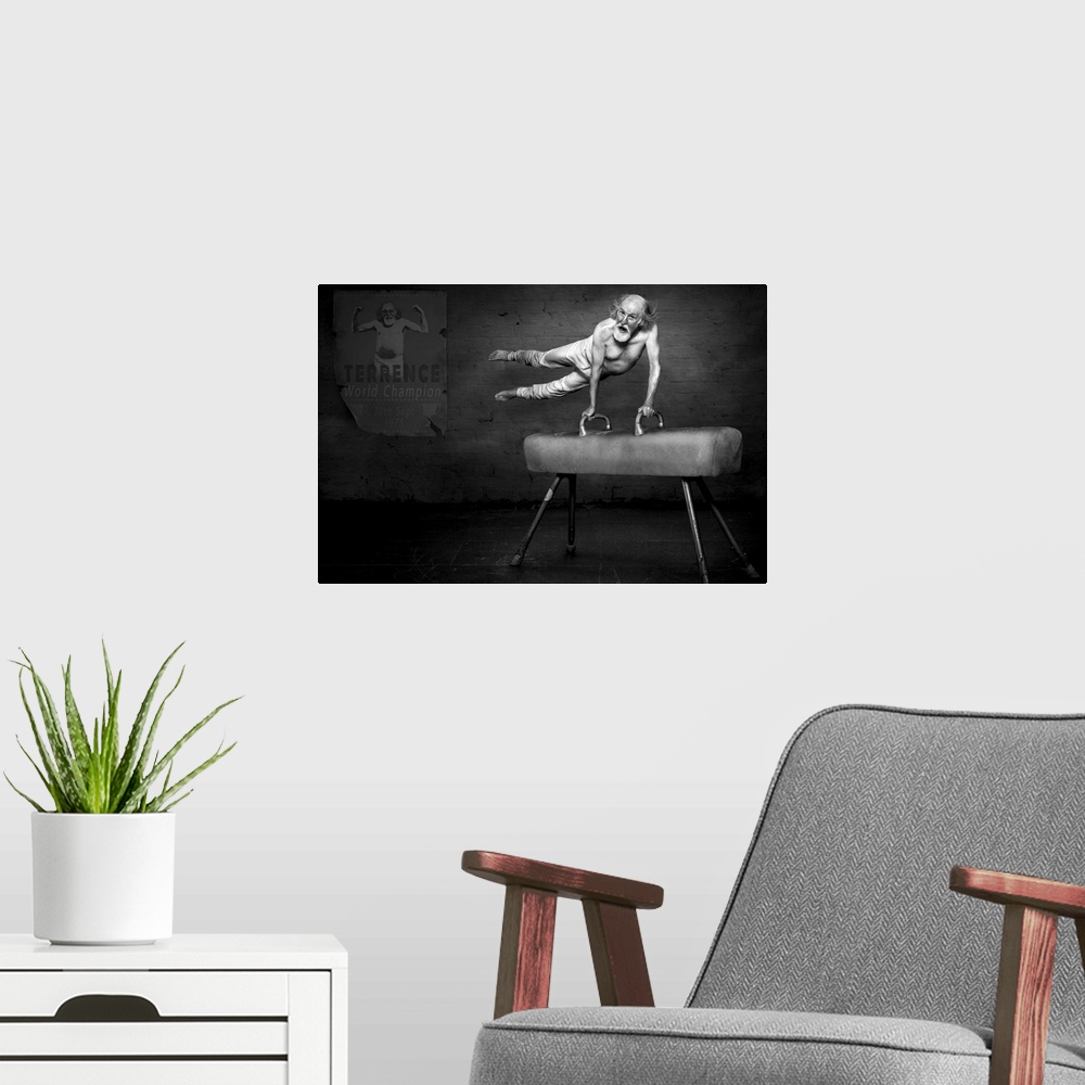 A modern room featuring Black and white portrait of an elderly man on a pommel horse, with a poster showing his accomplis...