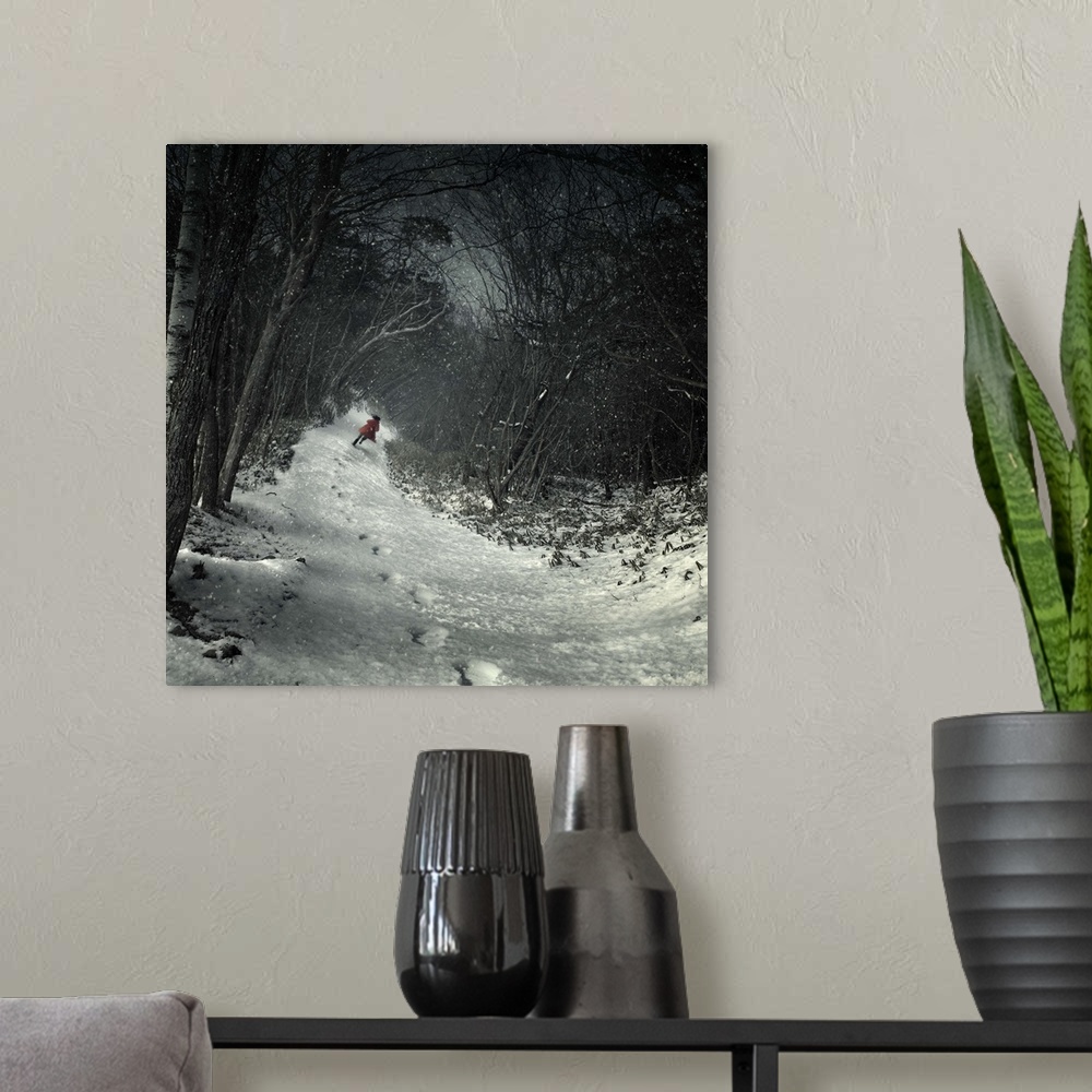 A modern room featuring A figure in a red coat running through the snow in a forest leaving a trail of footprints, the tr...