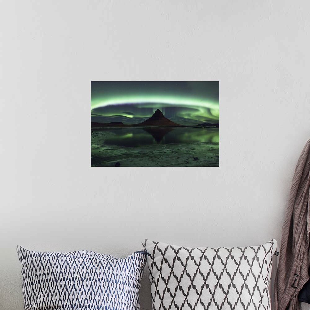 A bohemian room featuring Swirling and glowing northern lights above Kirkjufell Mountain in Iceland.