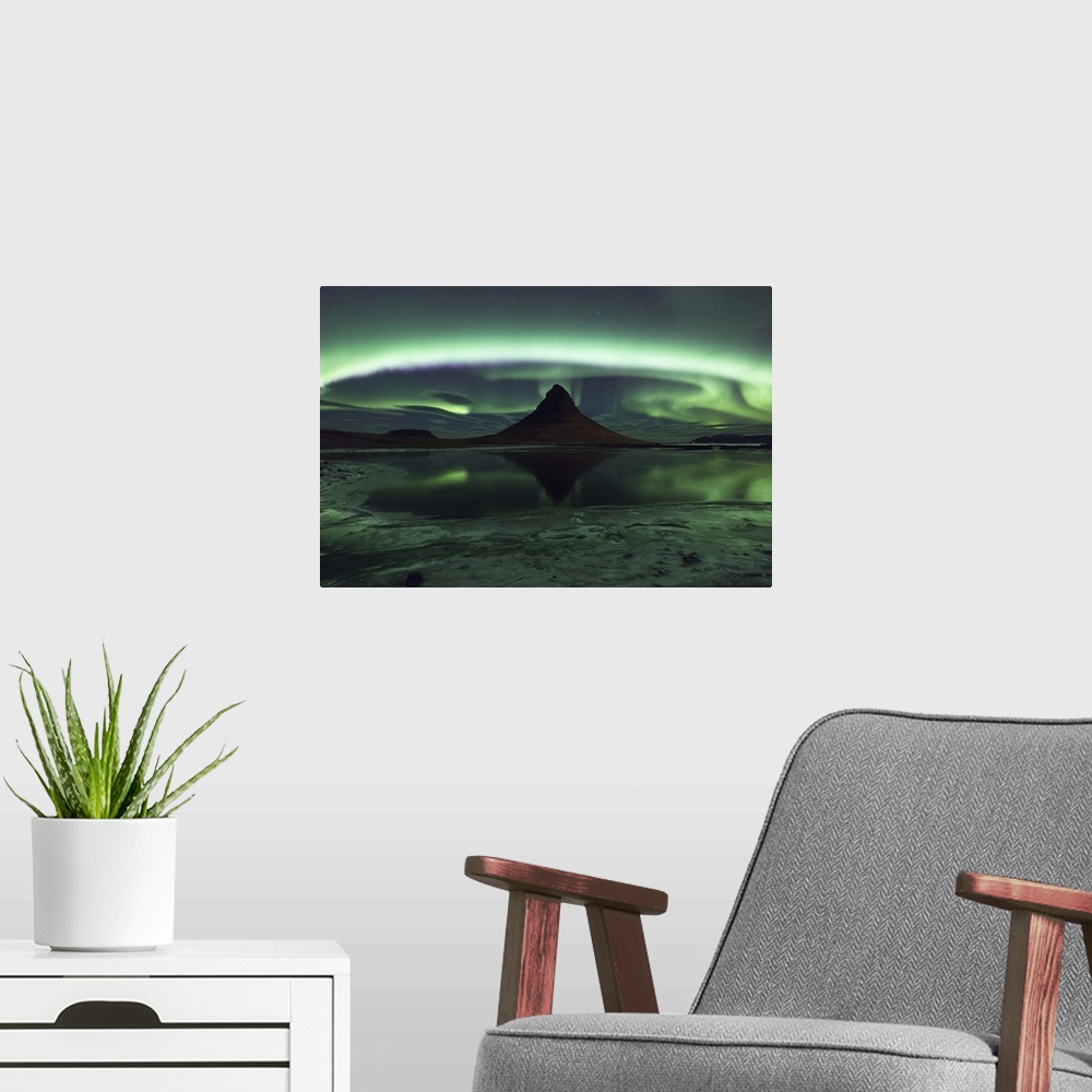 A modern room featuring Swirling and glowing northern lights above Kirkjufell Mountain in Iceland.